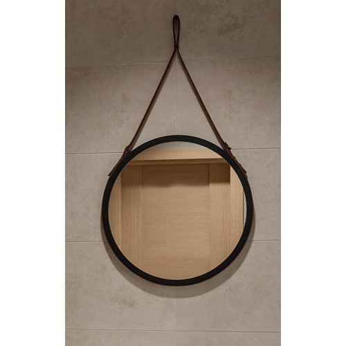 Runder Spiegel in mattschwarzem Rahmen auf schwarzem...